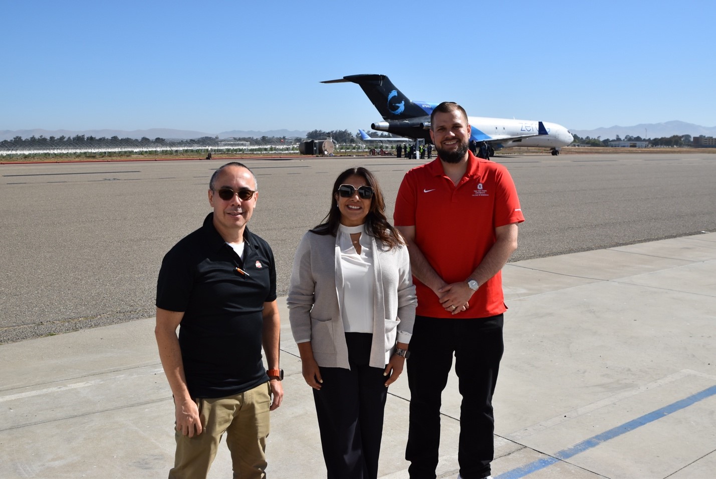 Ohio State Professor Dr. Antonio Ramirez, Air Force Research Laboratory Materials Engineer Dr. Arlene Smith, and Ohio State Assistant Professor Boyd Panton on the Santa Maria Airport tarmac in front of the Zero G Boeing 727